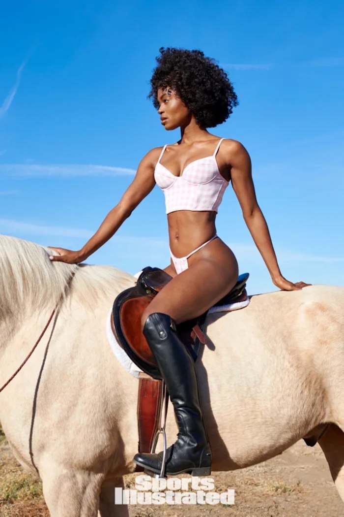 Tanaye White sits in the saddle atop a white horse in a pink and white gingham bikini set.